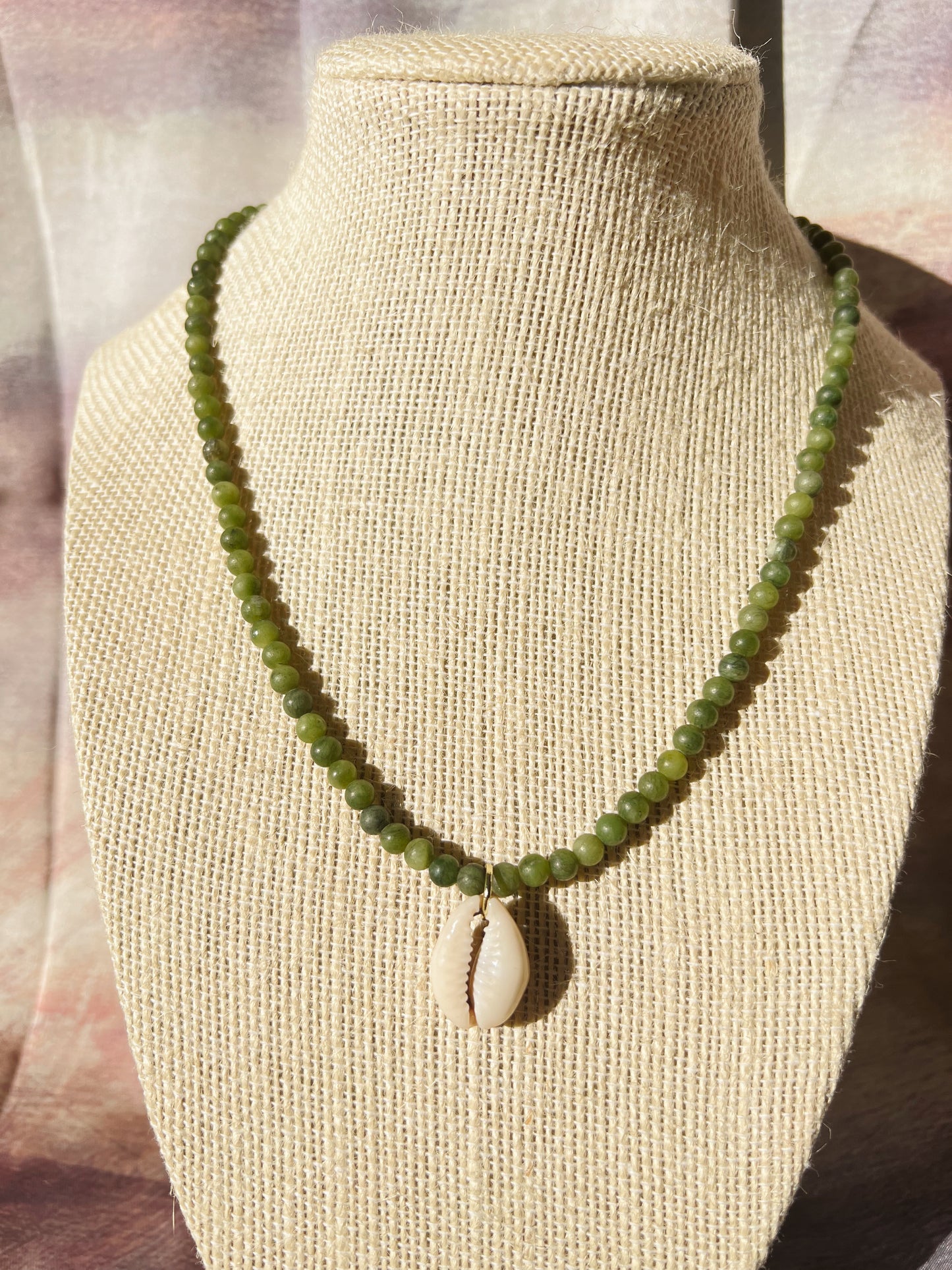 green olivine cowrie necklace